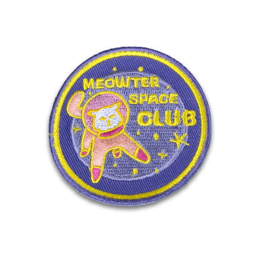 Photograph of Cute Cat Astronaut (Catstronaut) iron-on patch, floating in space, reads the phrase 'Meowter Space Club'.